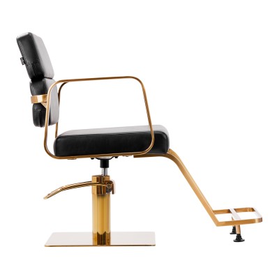 Gold accented black barber chair