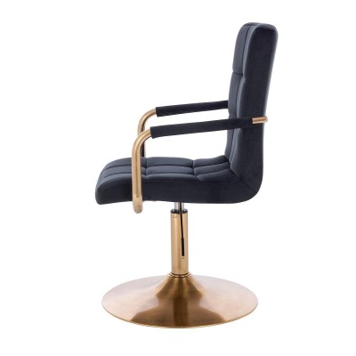 Czarne welurowe krzesło złota podstawa