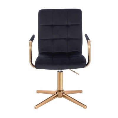 Czarny welurowy fotel złoty krzyżak