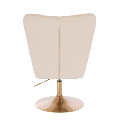 Kremowy fotel welurowy złota podstawa