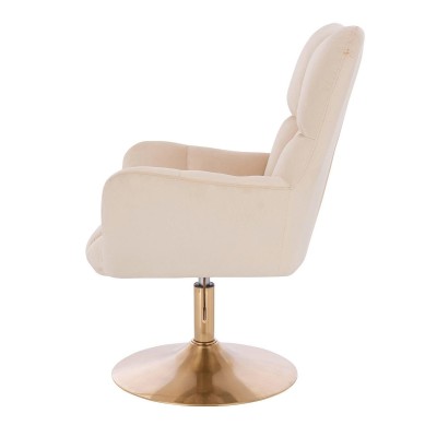 Welurowy kremowy fotel złota podstawa