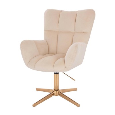 Kremowy welurowy fotel złoty krzyżak