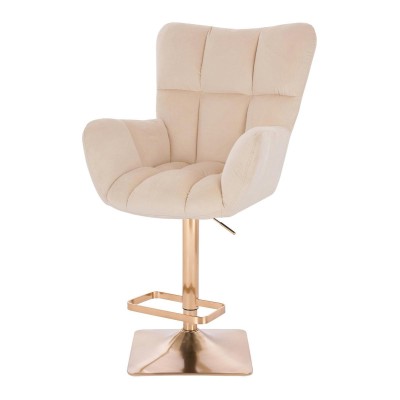 Kremowy welurowy fotel złota podstawa