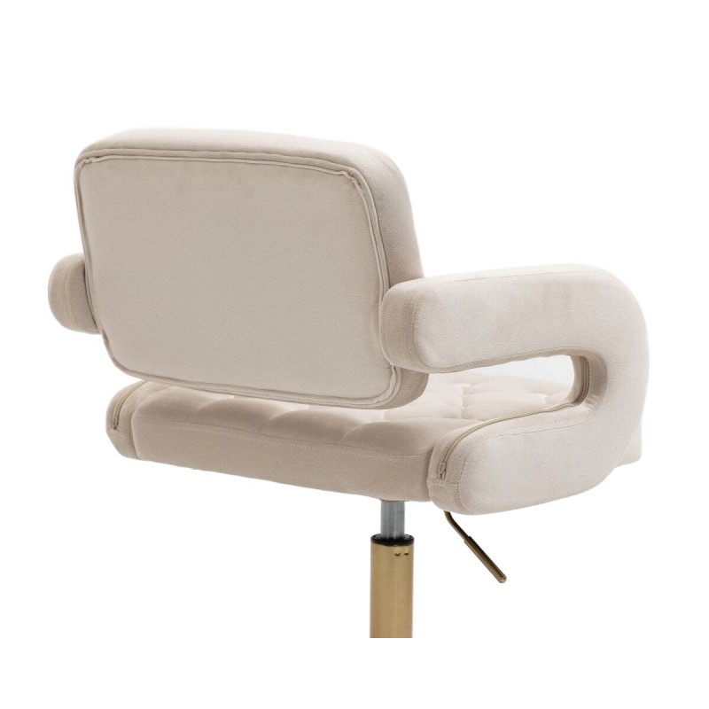 Kremowe krzesło welurowe złota podstawa