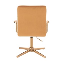 Miodowe welurowe krzesło złoty krzyżak