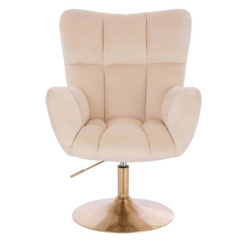 Kremowy welurowy fotel złota podstawa