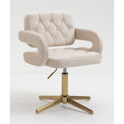 Kremowe welurowe krzesło złota podstawa