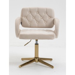 Kremowe welurowe krzesło złota podstawa