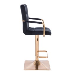 Czarne krzesło welurowe złota podstawa