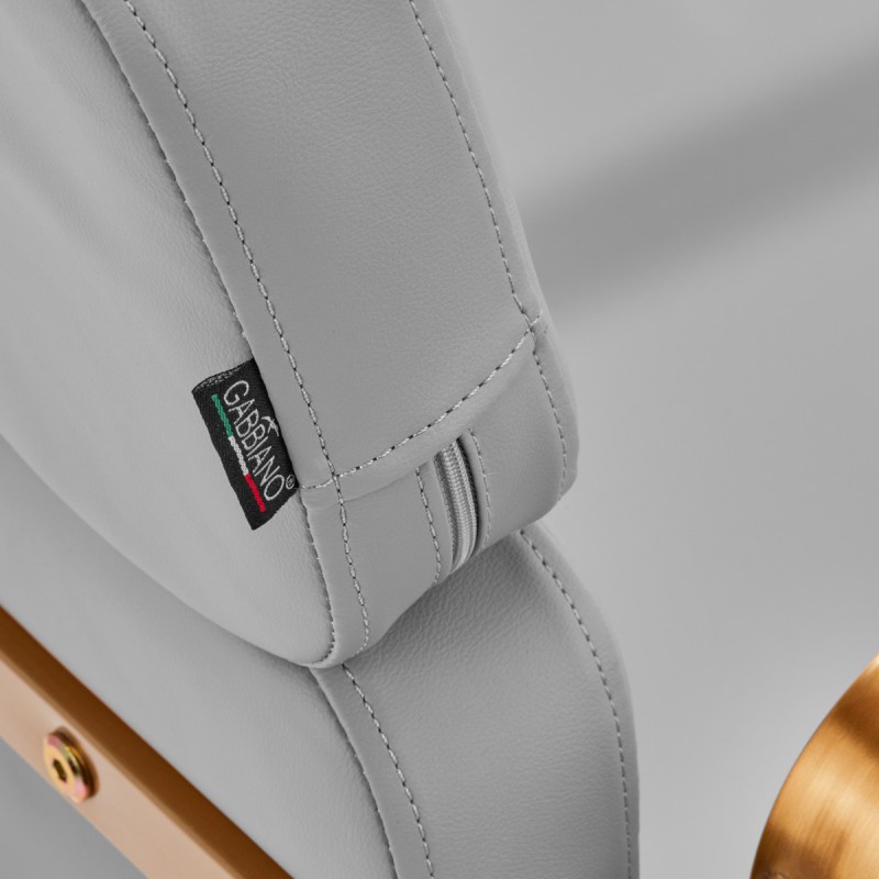 Szary fotel fryzjerski złote elementy